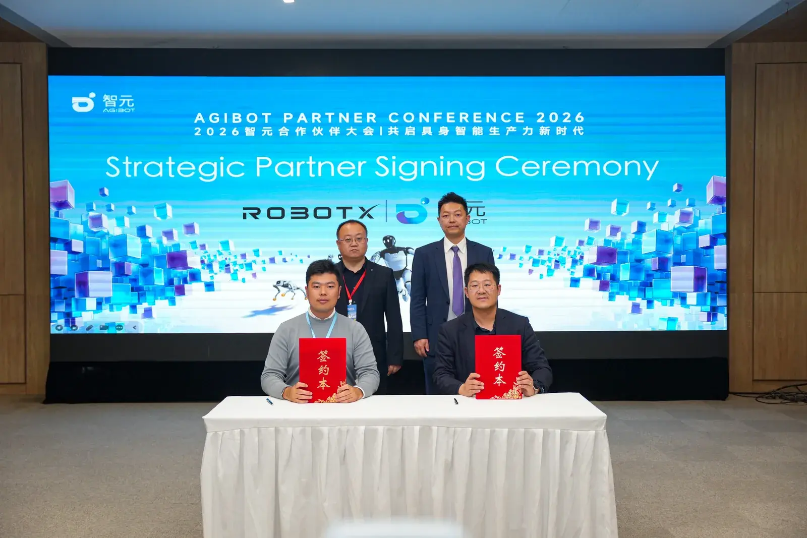 Principals from RobotX, AGIBOT, Mangobot, and Always Robotics at the signing table.